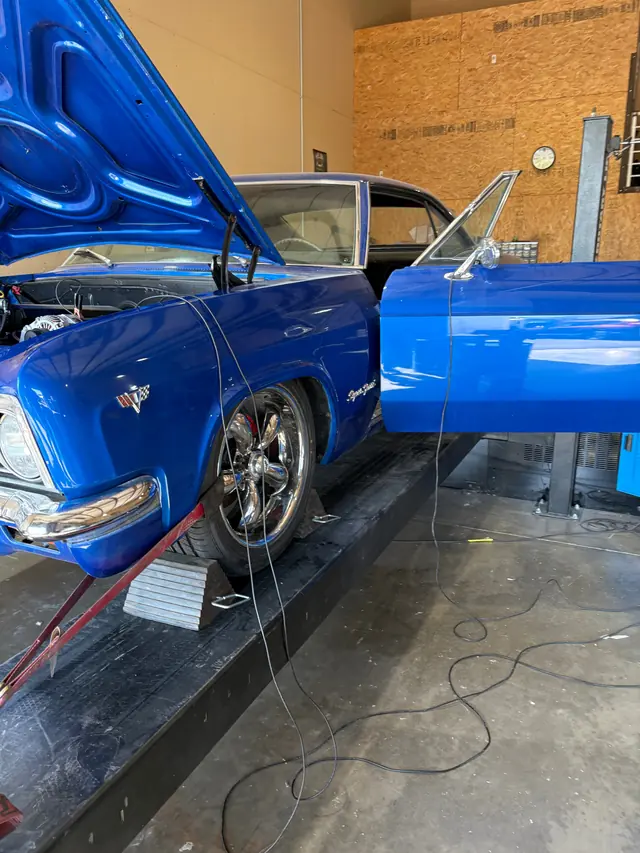 Blue classic muscle car with hood open for an LS swap retrofit tune